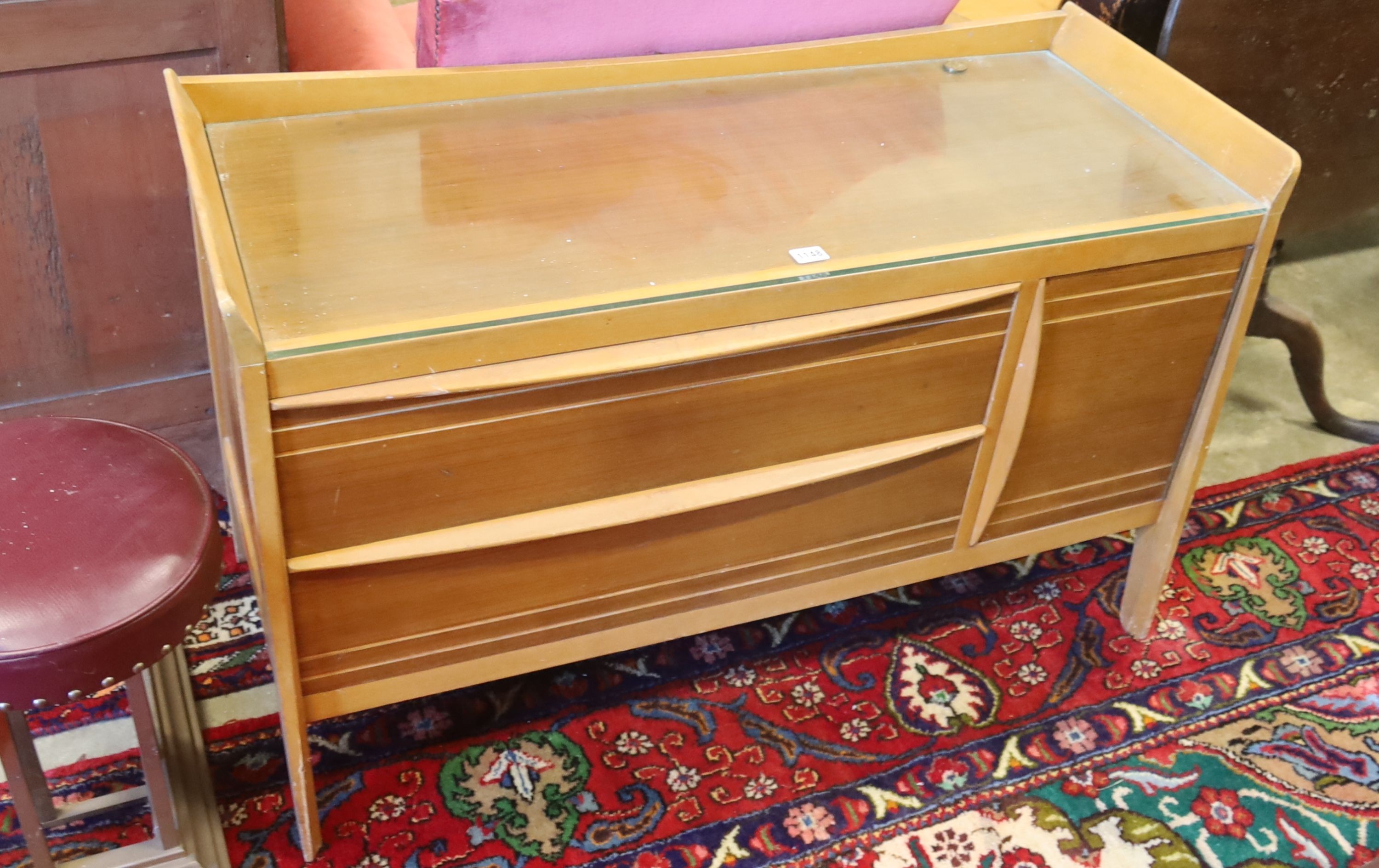 A mid century design teak low cabinet, length 108cm, depth 44cm, height 67cm